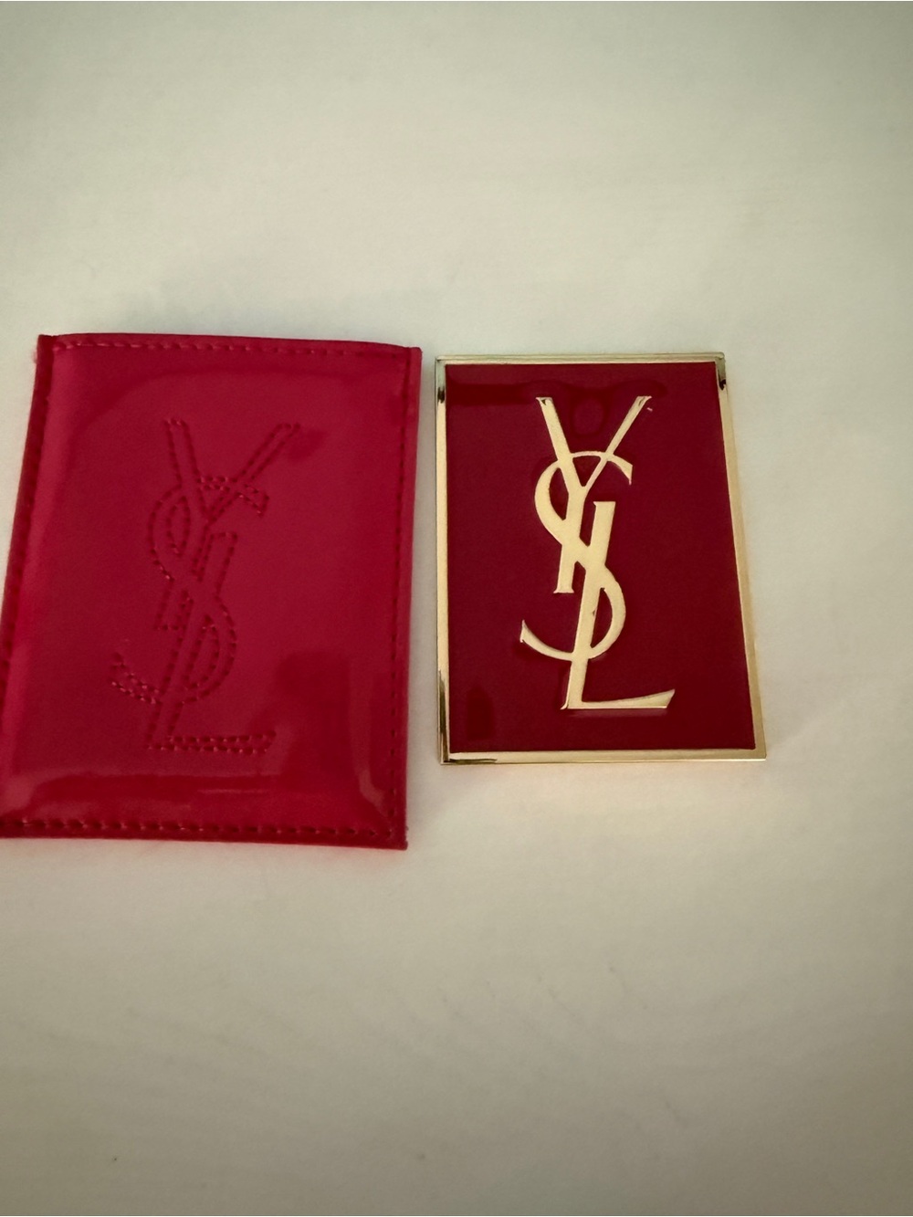 Here is a product listing for the Yves Saint Laurent pocket mirror and sleeve se